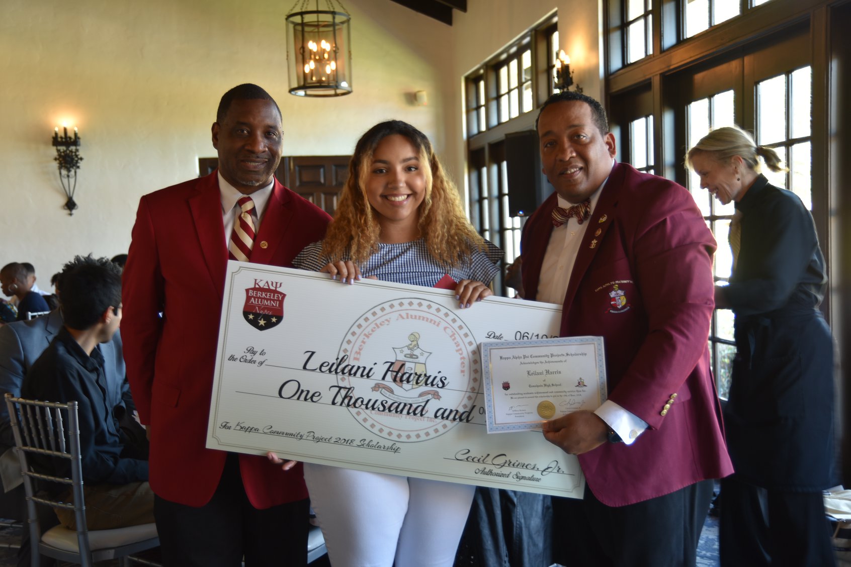 Leilani Harris with her scholarship check